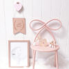 blush pink bow chair