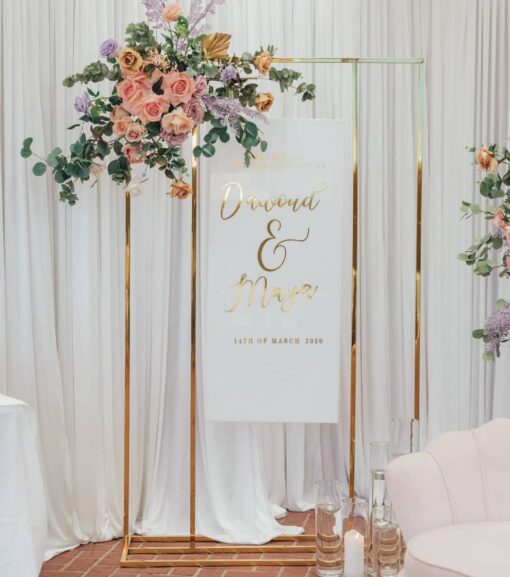 image of a gold & peach welcome sign