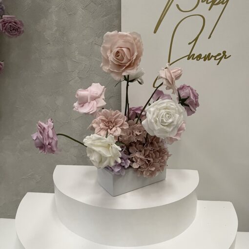 Pink, white & purple faux flower centrepiece