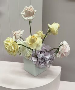 Pink, yellow & white faux flower centrepiece