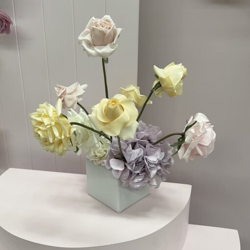 Pink, yellow & white faux flower centrepiece