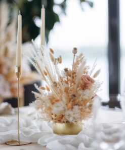 Vibrant Bohemian flower centerpiece with an array of colorful wildflowers, rustic elements, and artistic arrangement.