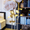 image of giant standing roses on a gold metal base