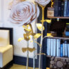 giant standing roses on a gold metal base