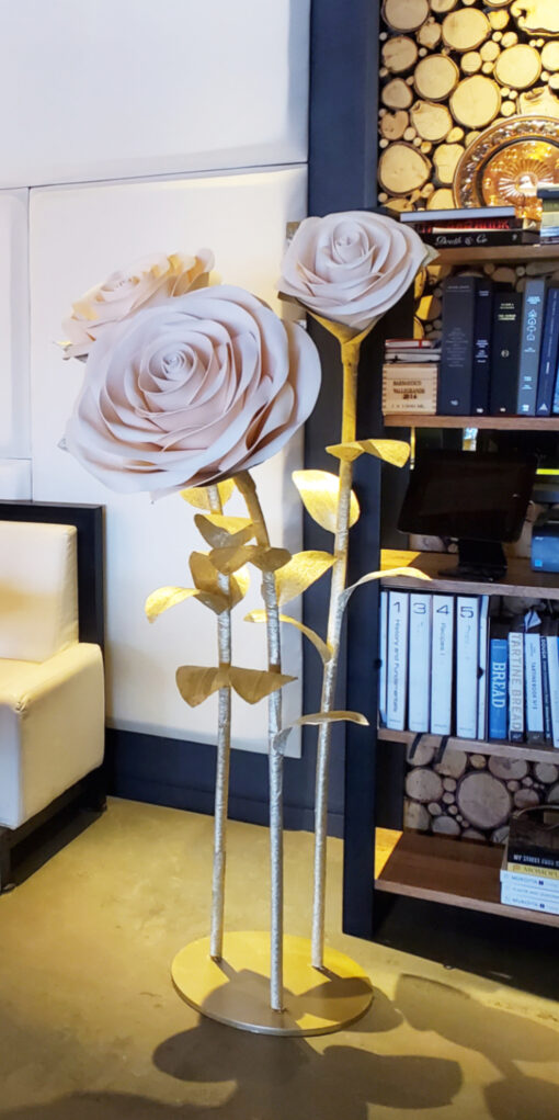 image of giant standing roses on a gold metal base