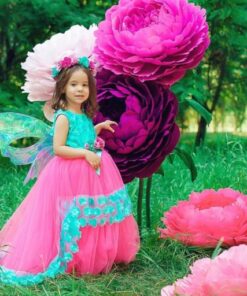 Mini giant flowers in lilac, dark purple, and fuchsia displayed outdoors for kids’ party decor in Toronto.