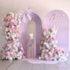 anna butterfly backdrop package with 3d arch and pink floral arrangements