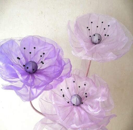 3 Lilac Blooms on a Metal Stand