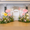 Floral Dreams Package featuring oversized pastel pink and white giant flowers, lush greenery, garden-style floral bushes, and elegant white backdrop panels for weddings, showers, birthdays, and luxury event decor.