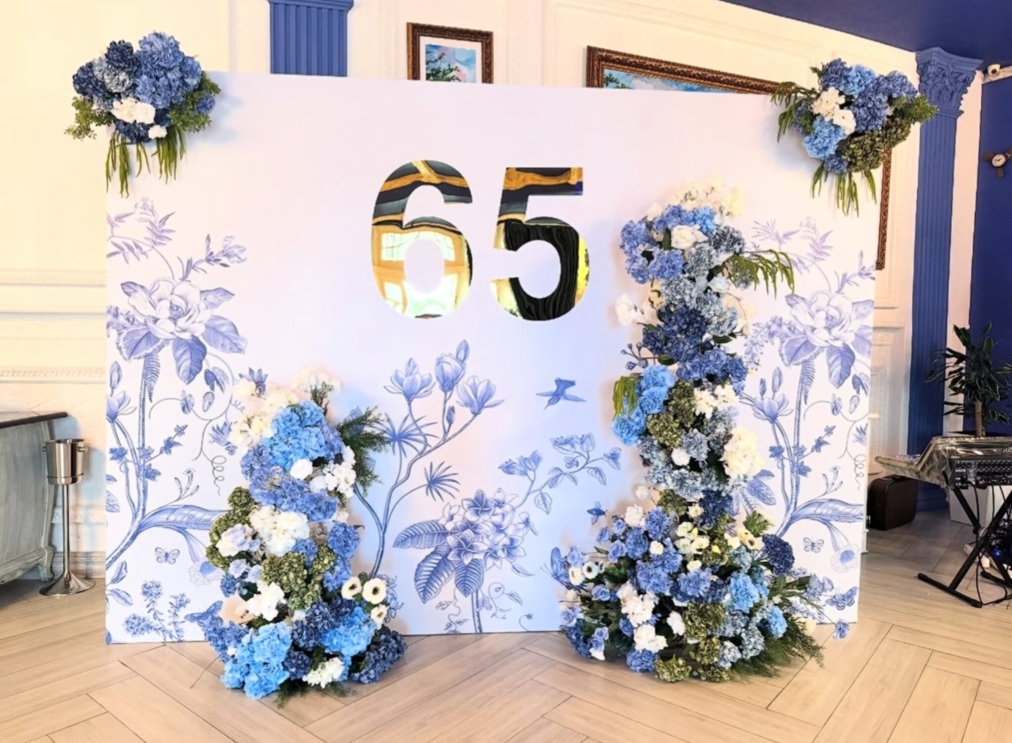 Blush pink arched backdrops and floral installations set up behind dining tables for a reception at Copper Creek Golf Club in Kleinburg, Vaughan.