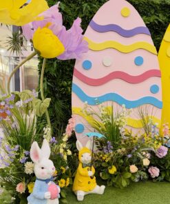 Easter decor setup with giant flowers, pastel egg backdrop, bunny props, and spring floral arrangements at Bridlewood Mall in Scarborough, Toronto