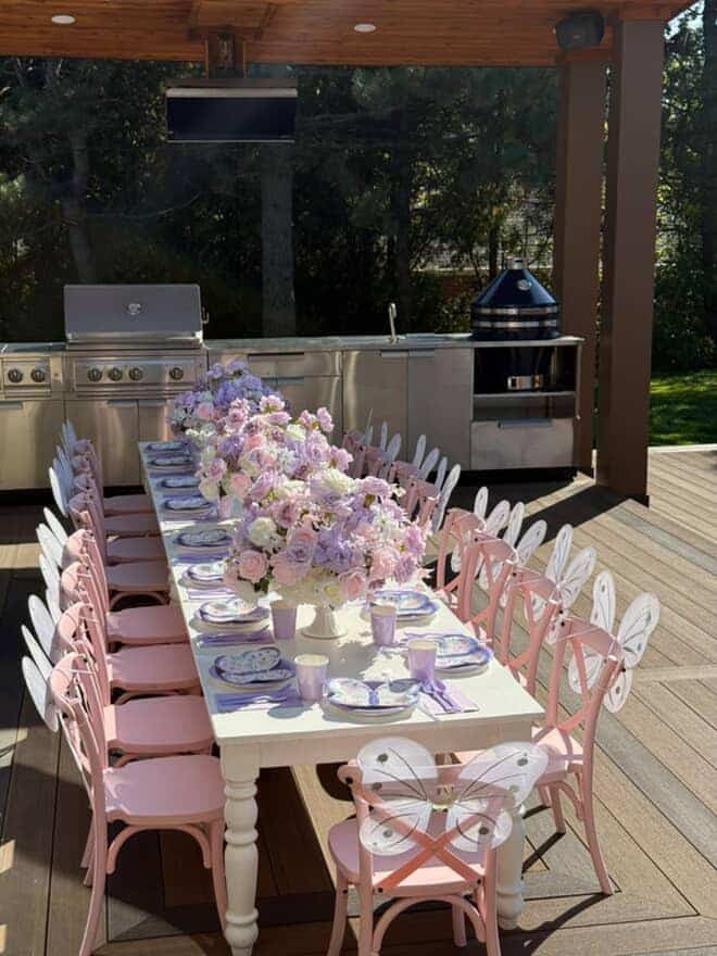 kids size pink crossback chairs ,white tables and table set up for a kid's birthday