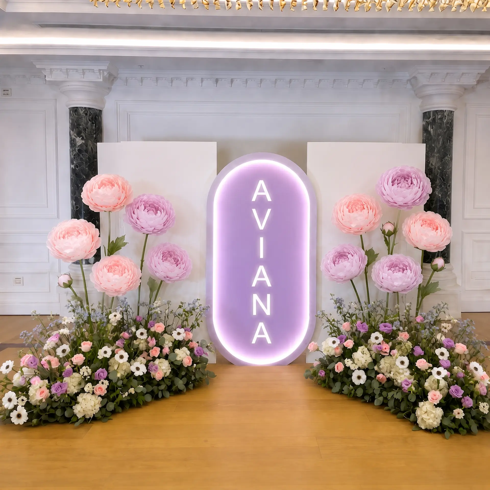 Enchanted Bloom Package with personalized name, giant pastel flowers, and lush pink, purple, and white floral arrangements.