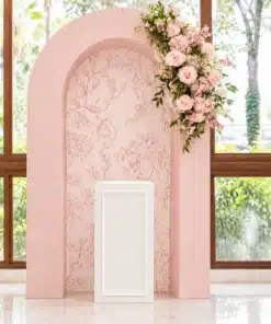 Blush pink floral package with a soft floral-patterned centre panel, cascading pink and ivory flower arrangement, and white framed plinth for elegant events.