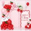 Cherry first birthday backdrop with pink, red and white balloons, custom cherry decorations, pink checkered arch, and personalized wavy birthday sign.