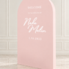 Elegant freestanding 3D arched backdrop available in ivory, blush pink, baby blue, and champagne gold, featuring a modern rounded top and personalized white wedding lettering.