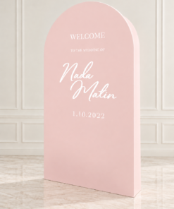 Elegant freestanding 3D arched backdrop available in ivory, blush pink, baby blue, and champagne gold, featuring a modern rounded top and personalized white wedding lettering.