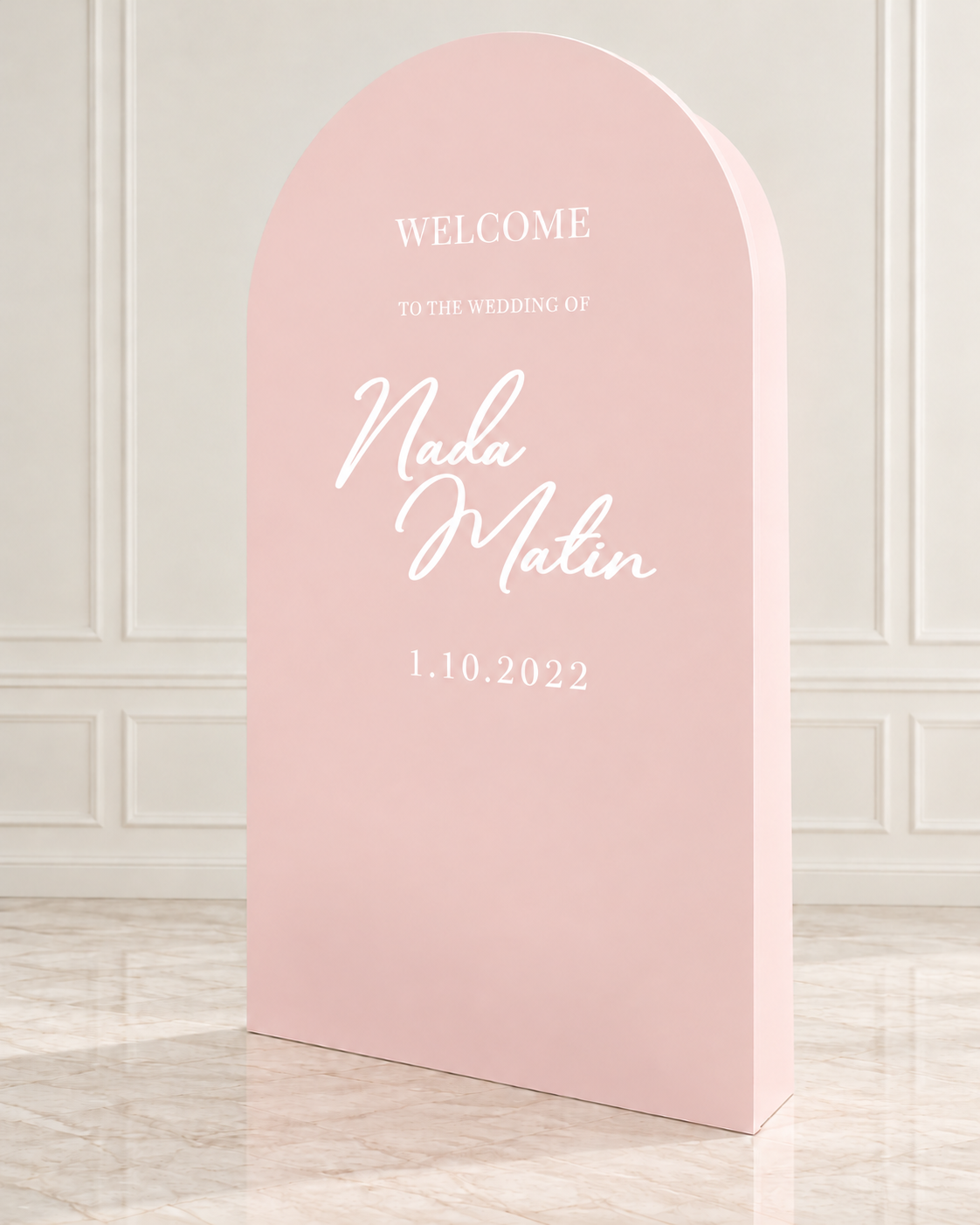 Elegant freestanding 3D arched backdrop available in ivory, blush pink, baby blue, and champagne gold, featuring a modern rounded top and personalized white wedding lettering.