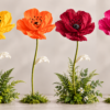 giant silk poppy flowers in yellow, orange, deep burgundy red, and fuchsia pink with tall green stems and decorative leaves.