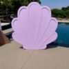 Lavender seashell-shaped event backdrop with raised shell detailing, ideal for mermaid parties, under-the-sea themes, birthdays, baby showers, and photo areas.