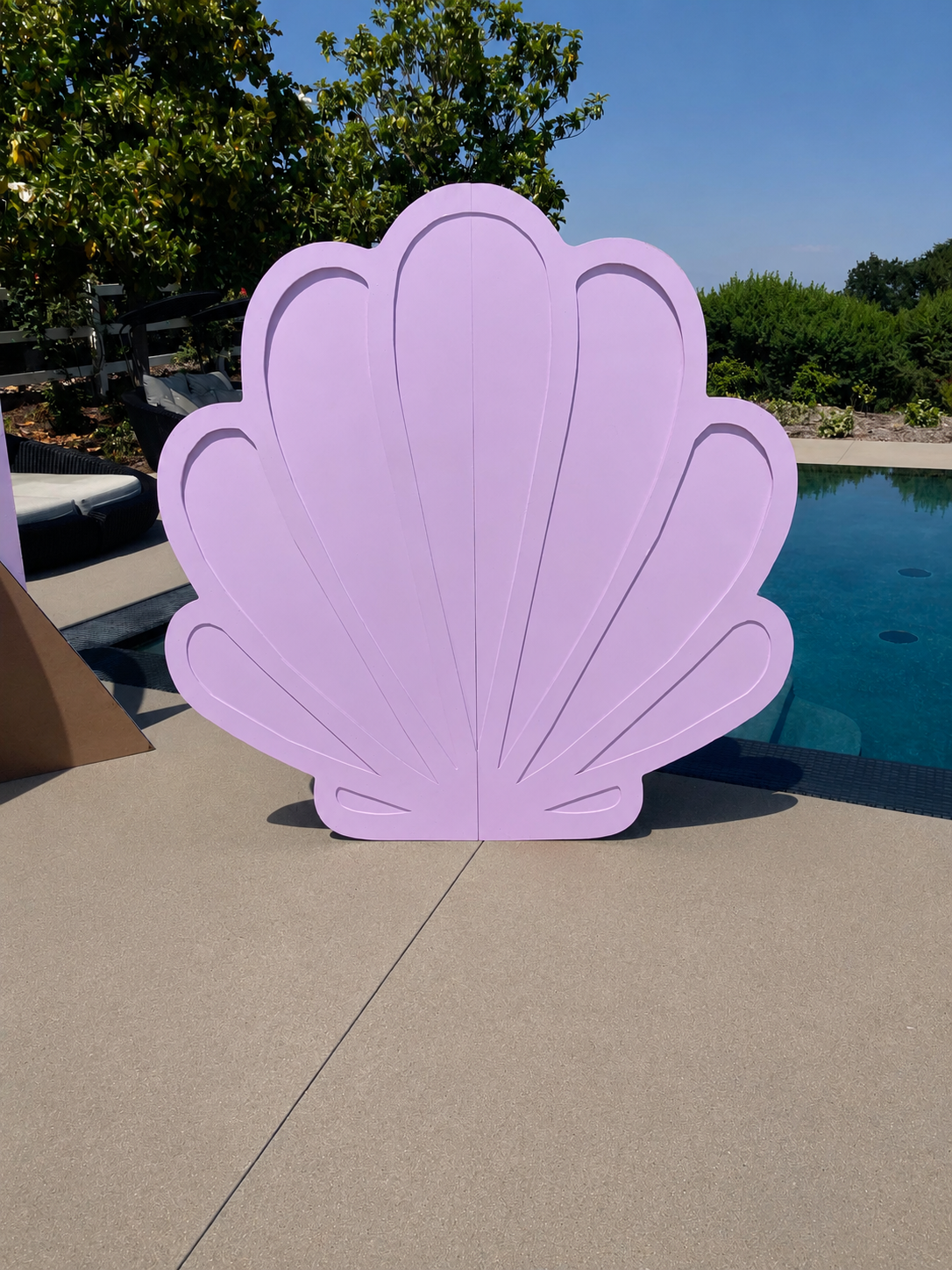 Lavender seashell-shaped event backdrop with raised shell detailing, ideal for mermaid parties, under-the-sea themes, birthdays, baby showers, and photo areas.
